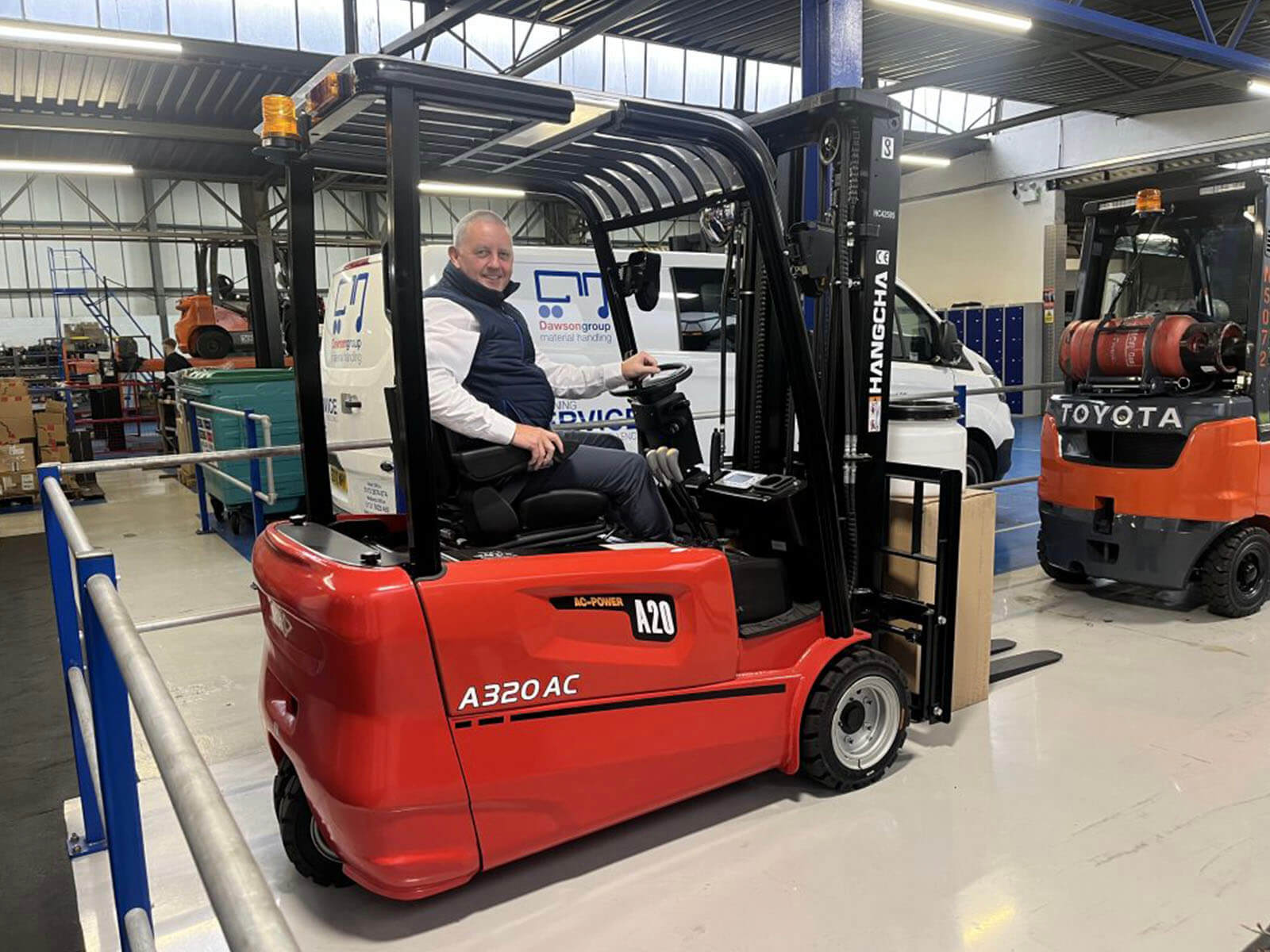 Paul Hull with material handling equipment